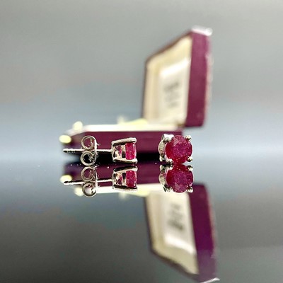 Lot 823 - A pair of modern 18ct white gold ruby set...
