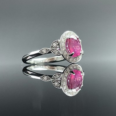 Lot 701 - A modern 18ct white gold, ruby and diamond...