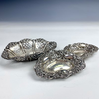 Lot 81 - A pair of Edwardian silver foliate scroll and...