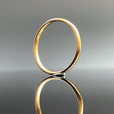 Lot 603 - A hallmarked 22ct gold band ring, Sheffield...