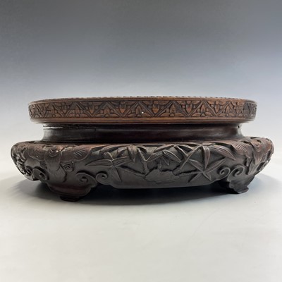 Lot 542 - A large Chinese carved hardwood stand, 19th century,.