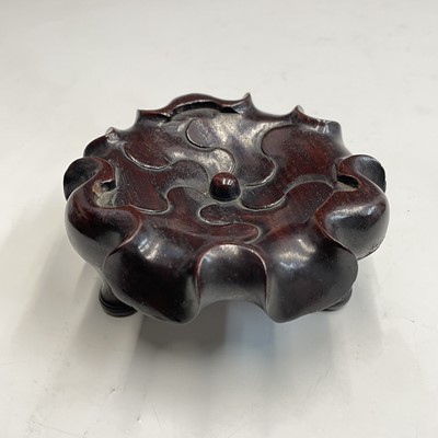 Lot 542 - A large Chinese carved hardwood stand, 19th century,.