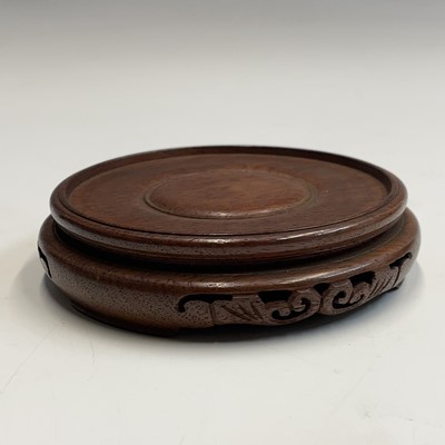 Lot 542 - A large Chinese carved hardwood stand, 19th century,.