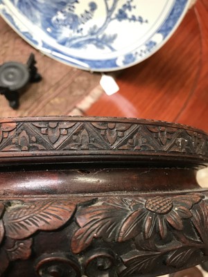 Lot 542 - A large Chinese carved hardwood stand, 19th century,.