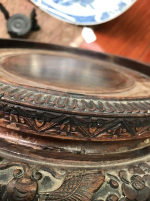 Lot 542 - A large Chinese carved hardwood stand, 19th century,.