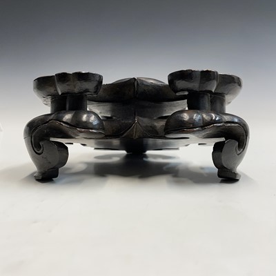 Lot 542 - A large Chinese carved hardwood stand, 19th century,.
