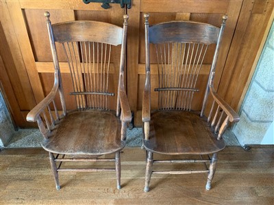 Lot 396 - A near pair of American oak armchairs, with a...