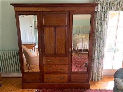 Lot 369 - An Edwardian mahogany wardrobe, the central...