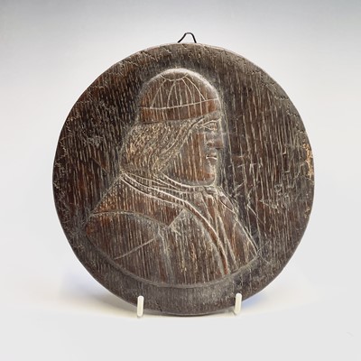 Lot 87 - A naive carved oak roundel, 19th century,...