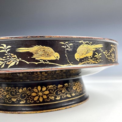 Lot 159 - A Chinese black and gilt lacquered footed...