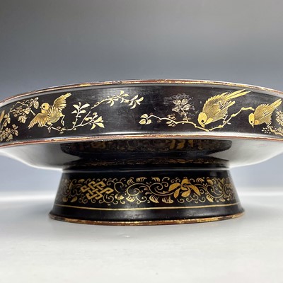 Lot 159 - A Chinese black and gilt lacquered footed...