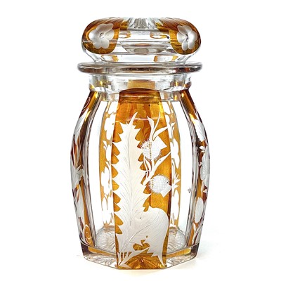 Lot 856 - A Bohemian amber flash glass jar and cover,...