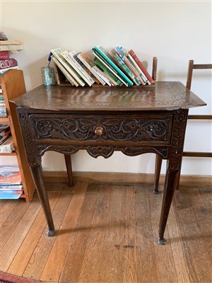 Lot 350 - A carved oak lowboy, 18th century, with single...