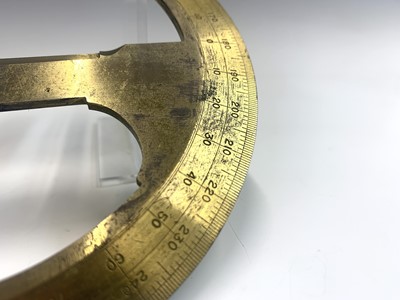Lot 205 - A late 19th century brass circular protractor...