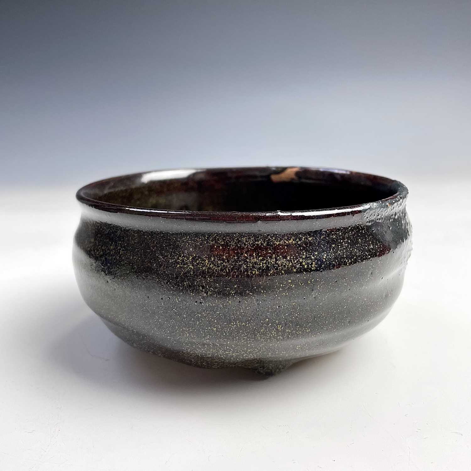 Lot 178 - A Japanese brown glazed stoneware tea bowl,...