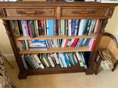 Lot 332 - A Victorian carved walnut open bookcase, with...