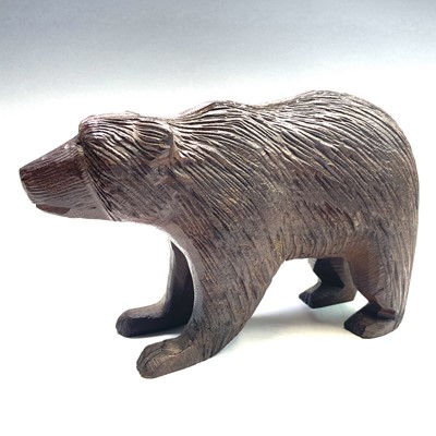 Lot 312 - A Black Forest style carved hardwood bear,...