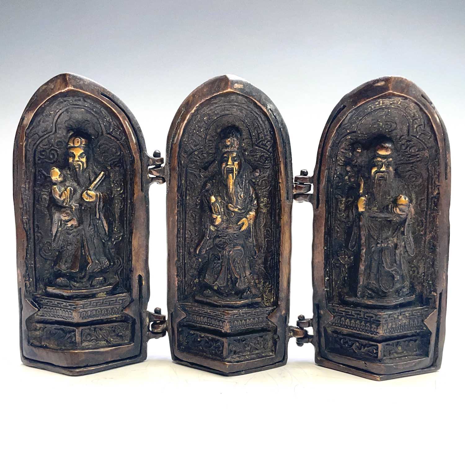 Lot 311 - An Eastern bronze triptych portable shrine,...