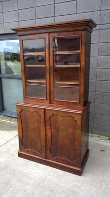 Lot 15 - A Victorian bookcase with figured veneers, the...