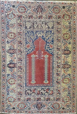 Lot 1223 - A Turkish prayer rug, circa 1920, the madder...