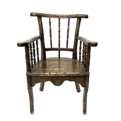 Lot 223 - A Japanese spindle-back carved wood armchair,...