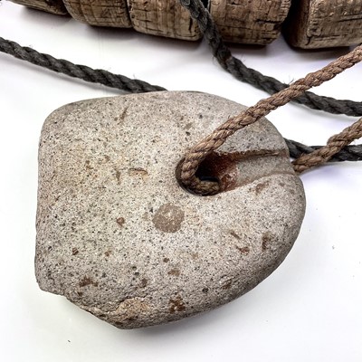 Lot 153 - Two strings of cork floats and stoneware end...