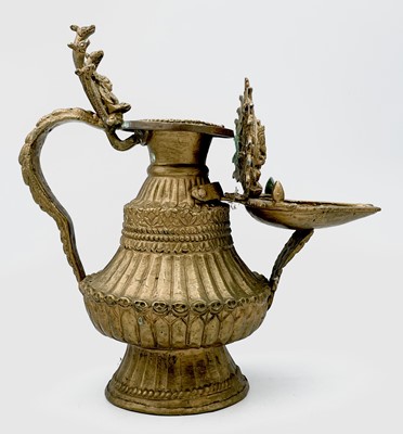 Lot 1027 - An Indian gilt metal temple lamp, 19th century,...