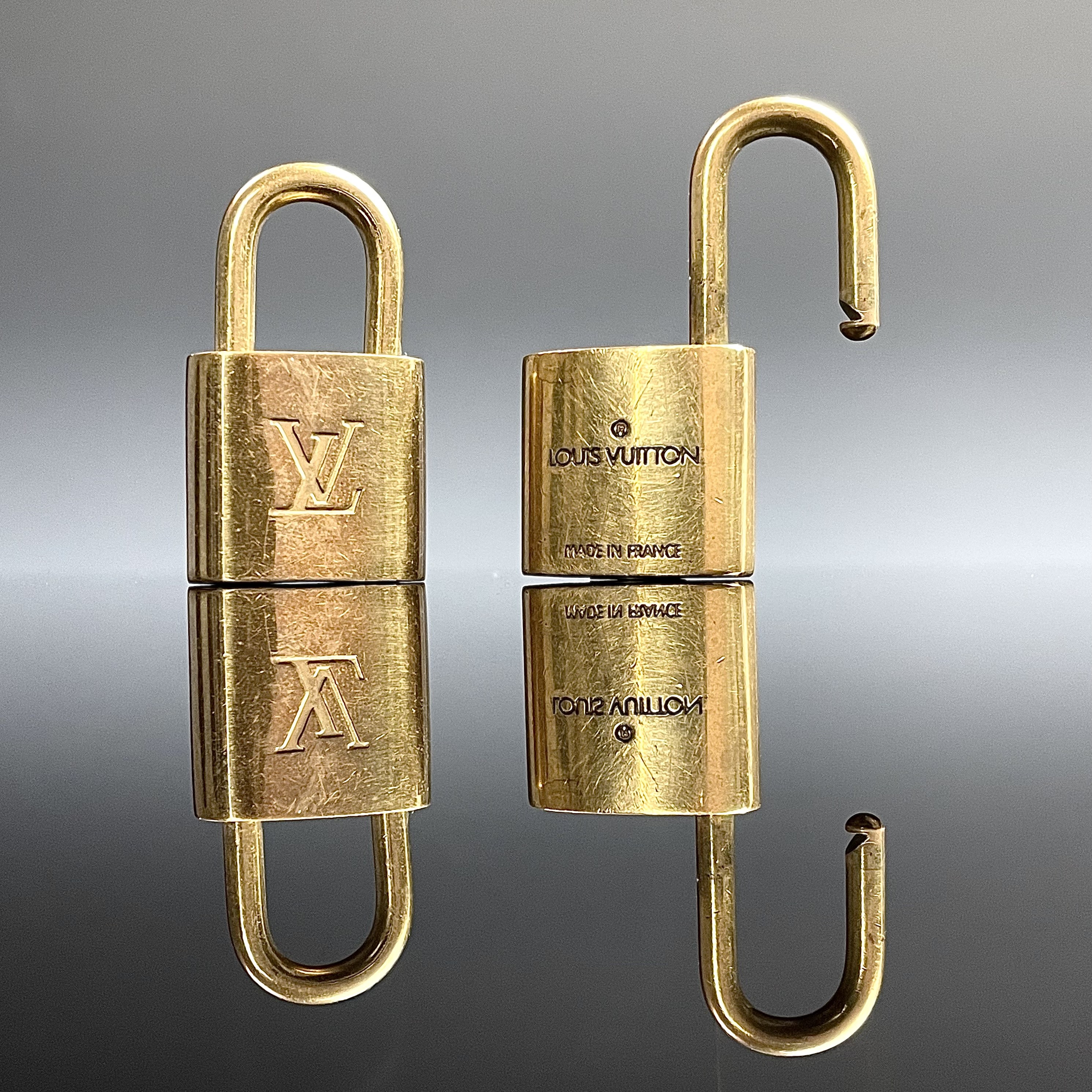 Sold at Auction: Louis Vuitton, LOUIS VUITTON PadLock Lock Key