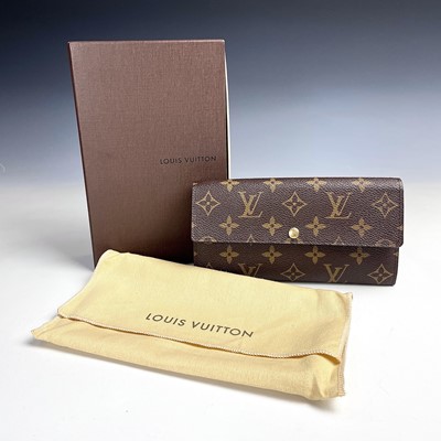 Lot 1036 - A Louis Vuitton purse, with original cloth bag...