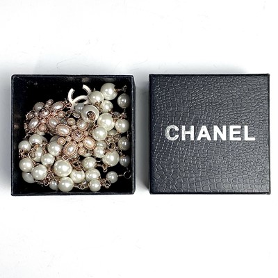 Lot 1053 - A Chanel rose gold plated, white enamel and...