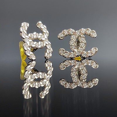 Lot 1019 - A pair of Chanel gold plated cz set clip on...