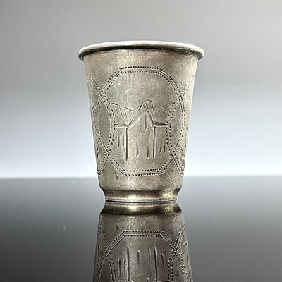 Lot 100 - A Russian silver vodka cup, engraved with...