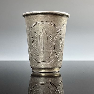 Lot 100 - A Russian silver vodka cup, engraved with...