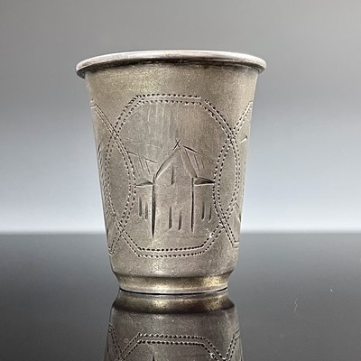 Lot 100 - A Russian silver vodka cup, engraved with...