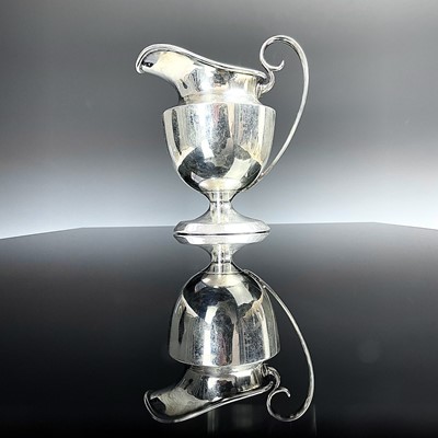 Lot 97 - A George VI silver pedestal milk jug, makers...