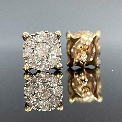 Lot 601 - A pair of 10k gold diamond cluster stud...