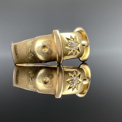 Lot 750 - An 18ct hallmarked gold buckle ring set with a...