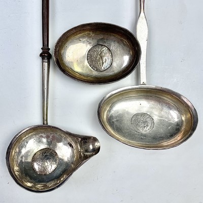Lot 131 - Three Georgian silver toddy ladles with baleen...