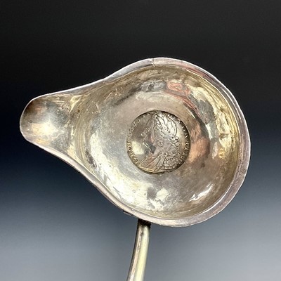 Lot 131 - Three Georgian silver toddy ladles with baleen...