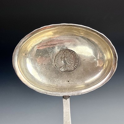 Lot 131 - Three Georgian silver toddy ladles with baleen...
