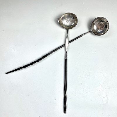 Lot 134 - Two Georgian silver toddy ladles with twisted...