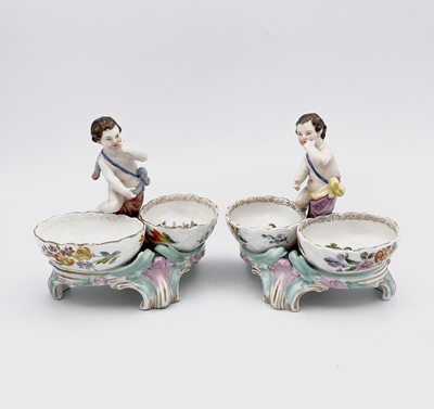 Lot 902 - A pair of Berlin porcelain cherub double salts,...