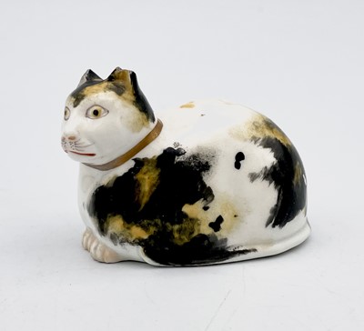 Lot 903 - A Derby porcelain figure of a recumbent cat,...