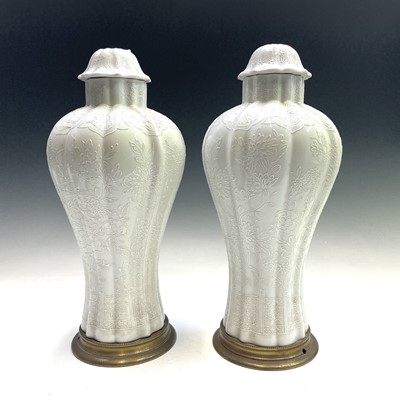 Lot 1023 - A pair of Continental porcelain vases and...