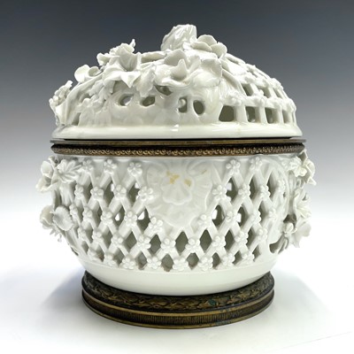 Lot 906 - A white glazed pierced basket and cover,...