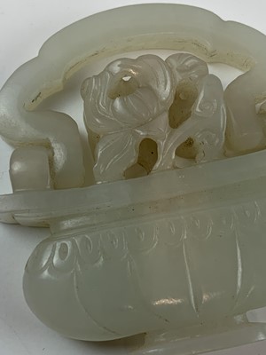 Lot 54 - A Chinese jade-type pendant in the form of a...