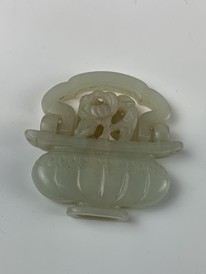 Lot 54 - A Chinese jade-type pendant in the form of a...