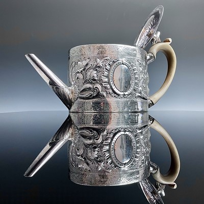 Lot 107 - A George III silver oval section teapot, of...