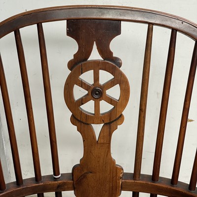 Lot 70 - A yew wood and elm Windsor elbow chair, circa...