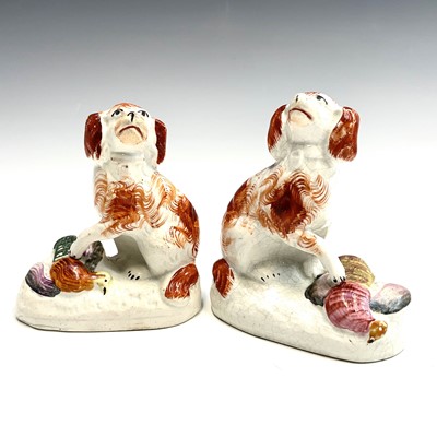 Lot 909 - A pair of Staffordshire pottery figures of...